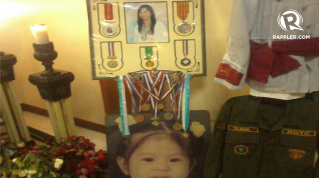 LOVE FOR EDUCATION. Displayed at Tejada’s wake were her medals and ROTC uniform. Photo by Buena Bernal