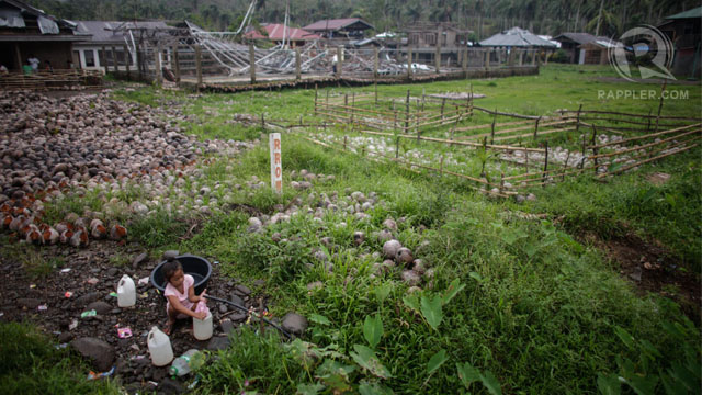 A young girl collects drinking water in storm-ravaged Lingig in Surigao del Sur. 3 Jan 2013, Photo by John Javellana.