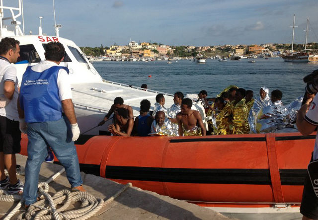 RESCUED IMMIGRANTS. A picture released by the Health Agency of Palermo on October 3, 2013 shows immigrants being rescued in Lampedusa early on October 3, 2013. AFP PHOTO /HO/ NINO RANDAZZO