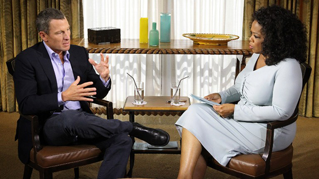 Cyclist Lance Armstrong talks to Oprah Winfrey. GEORGE BURNS / AFP