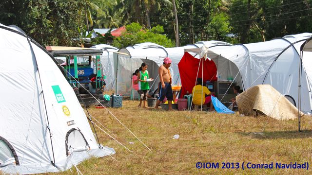 MORE HUMANE SHELTER. The International Organization for Migration (IOM) set up more decent tents for displaced and homeless people in Bohol. Photo by Conrad Navidad/IOM