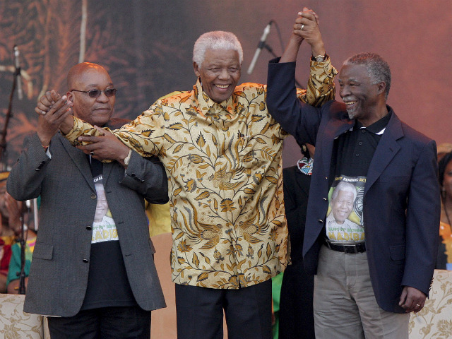 LEADERS. Nelson Mandela celebrates his 90th birthday in Pretoria, South Africa with South African leaders Thabo Mbeki (right) and Jacob Zuma (left). File photo by Kim Ludbrook/EPA
