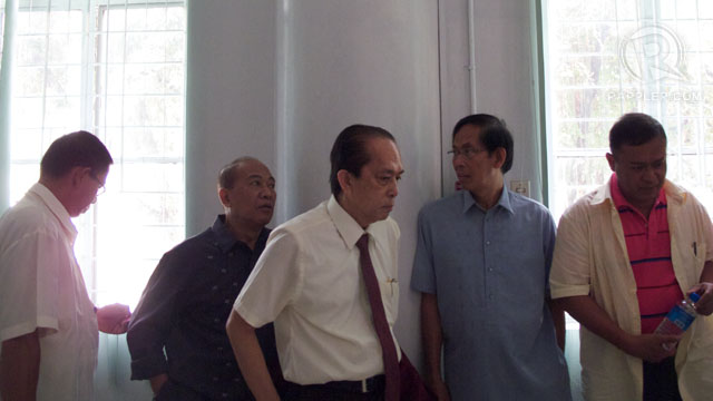 ACCUSED. Osorio (far left), Palparan (fourth from left) and Hilario (far right) wait at the Department of Justice after a hearing. Photo by Carlo Gabuco