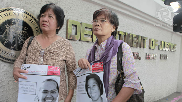 STILL SEARCHING. The mothers of Sherlyn Cadapan and Karen Empeño wait outside the Department of Justice. Photo by Geric Cruz