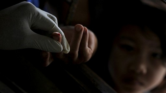 LONG-RUNNING BATTLE. Blood test on children at a clinic in Kanchanaburi province near the Thai-Myanmar border. Some Asian countries still in long-running battle against malaria, though deaths have declined. Photo by AFP
