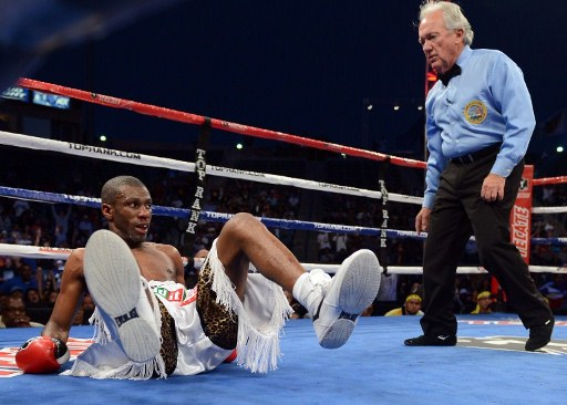 SAVED BY THE BELL. Jeffry Mathebula falls in Round 4 but stands up before the bell. Photo by AFP