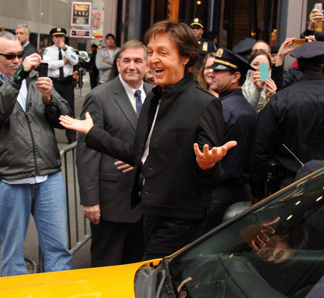 THERE AND GONE. McCartney arrives by taxi at Times Square. Photo: Kevin Mazur/Getty Images/AFP
