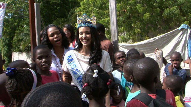 BEFORE THE ACCIDENT. Miss World 2013 Megan Young laughing with the children from the orphanage just moments before the collapse. Photo from Miss World website
