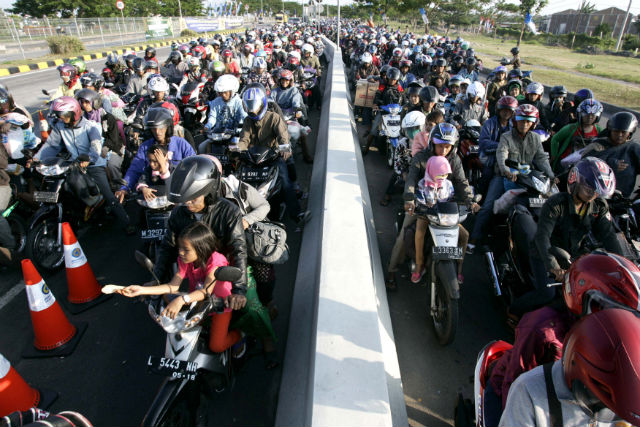 HEADING HOME. Indonesians on their motorbikes wait their turn to cross to Madura Island in East Java, in last year's mudik. During the last days of Ramadan, tens of millions of Indonesians leave the country's cities to return to their villages by motorcycle, train, bus and boat to celebrate the Eid al-Fitr holiday. File photo by EPA