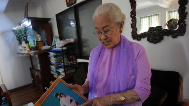 THE SIMPLE LIFE. The granddaughter of Myanmar's last king, princess Hteik Su Phaya Gyi shows her photo during an interview at her residence in Yangon. AFP Photo