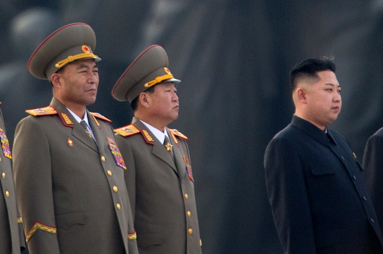 This photo taken on April 13, 2012 shows North Korean military chief Ri Yong-Ho (L) and North Korean leader Kin Jong-Un (R) at a ceremony in Pyongyang. North Korea's army chief Ri Yong-Ho has been relieved of all his posts due to illness, state media said on July 16, 2012, in a surprise development that removes one of new leader Kim Jong-Un's inner circle. AFP PHOTO / Ed Jones