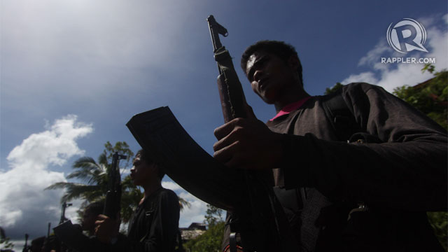 REBEL TERRITORY. NPA guerilla fighters performing a military drill somewhere in the mountains of Laak town in Comspotela Valley. File photo by Karlos Manlupig
