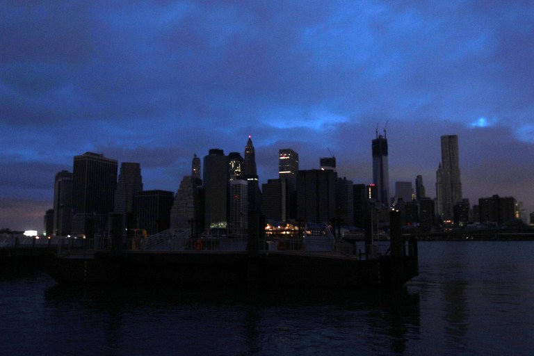 PLUNGED IN DARKNESS. The darkened skyline of lower Manhattan is seen one day after Hurricane Sandy on October 30, 2012. Life ground to a virtual halt in parts of southern Manhattan still without power, but many New Yorkers seemed to be taking the damage wrought by Hurricane Sandy in stride. AFP PHOTO /Mehdi Taamallah