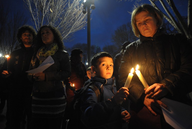 Gun control supporters take part in a candlelight vigil at Lafayette Square across from the White House on December 15, 2012 in Washington. Twenty-seven people, including the shooter, were killed on December 14 at Sandy Hook Elementary School in Newtown, Connecticut. AFP PHOTO/Mandel NGAN