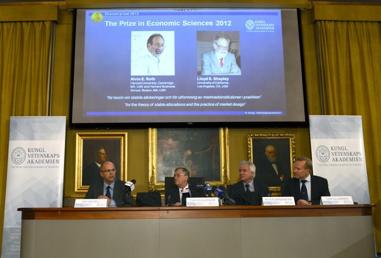 Per Krusell, Staffan Normark, Peter Gärdenfors and Tore Ellingsen of the Swedish Royal Academy of Sciences present the winners of the Nobel Memorial Prize in Economic Sciences, in Stockholm, Sweden, on Oct. 15, 2012. Alvin E. Roth of Harvard University, Cambridge, MA, USA, and Harvard Business School, Boston, MA, USA, and Lloyd S. Shapley of University of California, Los Angeles, CA, USA, won the prize 'for the theory of stable allocations and the practice of market design'. HENRIK MONTGOMERY / SCANPIX-SWEDEN / AFP