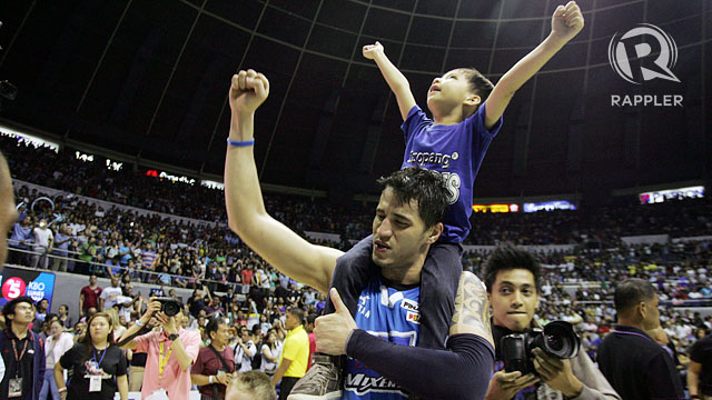 VICTORIOUS. Marc Pingris carries his son on his shoulders after carrying the SanMig Coffee Mixers in Game 7 of the PBA Governors' Cup Finals. Photo by Josh Albelda/Rappler