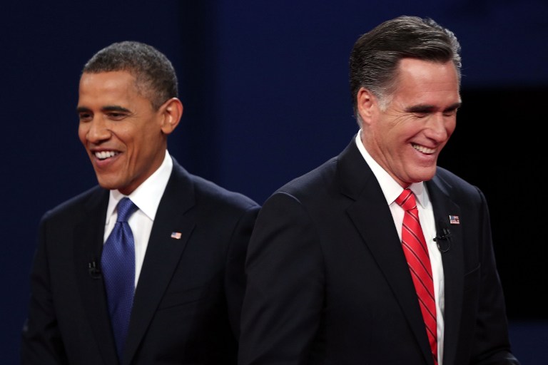 Democratic presidential candidate, U.S. President Barack Obama (L) walks away from Republican presidential candidate, former Massachusetts Gov. Mitt Romney (R) after the Presidential Debate at the University of Denver on October 3, 2012 in Denver, Colorado. Win McNamee/Getty Images/AFP