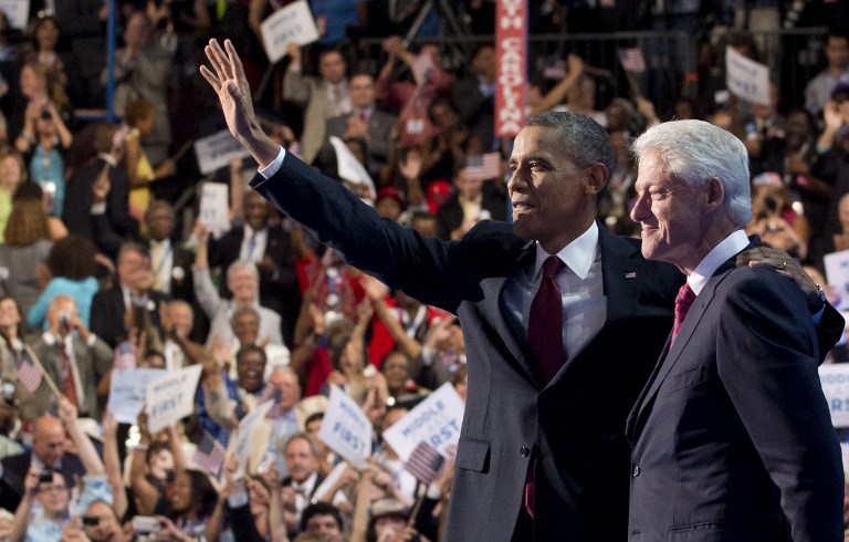 ENDORSED. US President Barack Obama waves alongside former US President Bill Clinton after Clinton's speech during the Democratic National Convention (DNC) at the Time Warner Cable Arena in Charlotte, North Carolina, on September 5, 2012. AFP PHOTO / Saul LOEB