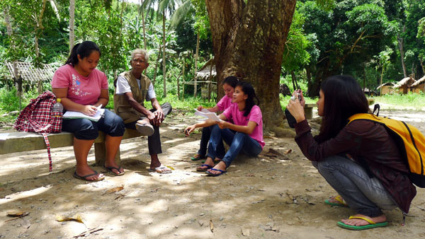 ALTERNATIVE MEDICINE. Students from Palawan State University interviewing the quack doctor for their thesis on alternative medicine. Photo by Henson Wongaiham