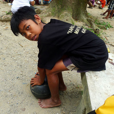 BATAK BOY'S DREAM. Gilbert, 10, loves to play basketball. He also likes girls with straight hair. One of his dreams is to study. Photo by Henson Wongaiham