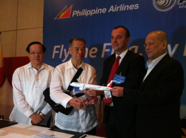 AIRBUS ORDERS. Philippine Airlines executives (chair Lucio Tan, second from left, and president Ramon Ang, rightmost) announce orders for new aircraft. Photo by Katherine Visconti