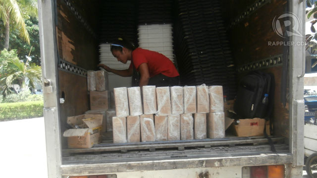 UNLOADING. PCOS machines are delivered to different areas. Parts are assembled in the local Comelec offices. 