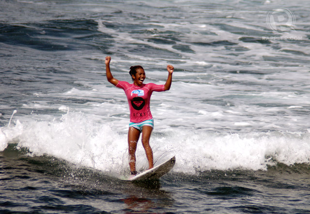 HURRAH FOR THE LOCALS! Surf champ Nilve Blancada celebrates her win with a big smile.