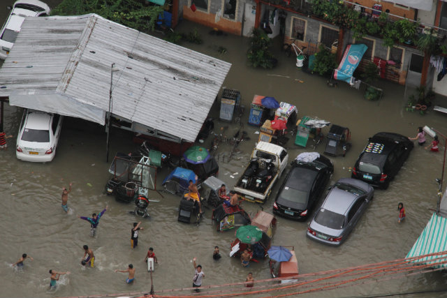 SUBMERGED. Nearly all of Pasay city's 200 barangays were affected by the deluge of rain over the Philippine metro. August 20 photo by EPA/TSG REY BRUNA / PAF