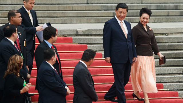 POWER COUPLE. Chinese President Xi Jinping and his wife Peng Liyuan outside the Great Hall of People in Beijing. Photo: Lintao Zhang/AFP