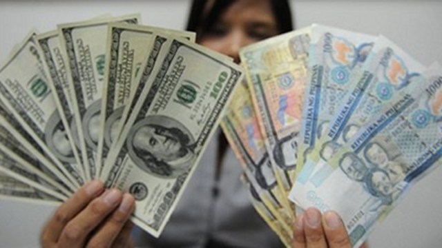 APPRECIATING. A strong Philippine peso against the US dollar has downside. Photo by AFP
