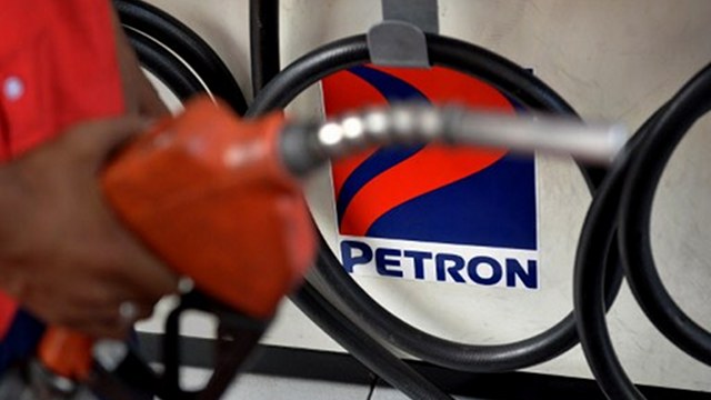 TRIPLE-DIGIT GROWTH. Petron's bottom line surged over 500% in the first half of 2013 from a year ago. Photo by AFP