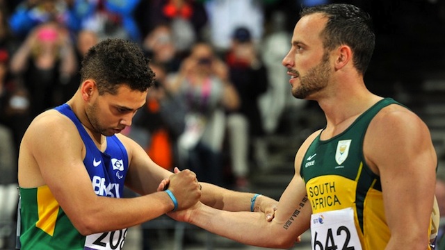 South Africa's Oscar Pistorius (R) shakes hands with Brazil's Alan Fonteles Cardoso Oliveira (L) after competing in the Men's 200m T44 Final athletics event during the London 2012 Paralympic Games at the Olympic Stadium in east London, on September 2, 2012. AFP PHOTO / GLYN KIRK