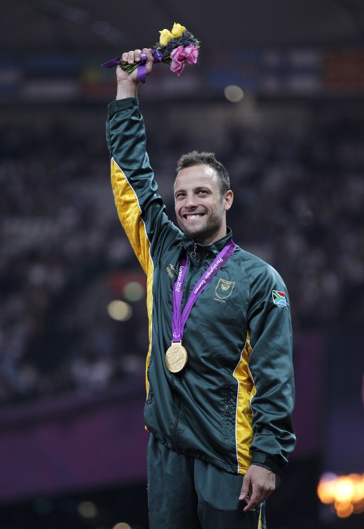 South Africa's Oscar Pistorius poses on the podium with his gold medal after winning the men's 400m - T44 final during the athletics competition at the London 2012 Paralympic Games at the Olympic Stadium in east London on September 8, 2012. AFP PHOTO / IAN KINGTON