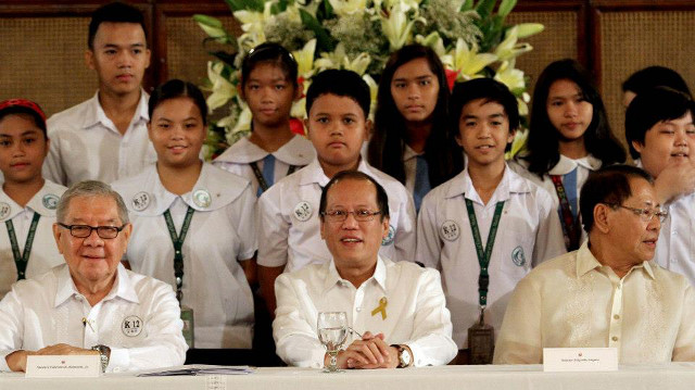 ENHANCED EDUCATION. President Aquino signs a law that hopes to enhance the future of education in the Philippines. Photo from Noynoy Aquino Facebook page