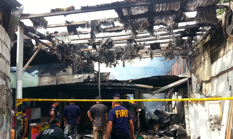 HOUSE-TURNED-SHOP. Fire officials estimate damages at P2.3M in a carpentry shop and its neighbor along Sgt Esguerra, Quezon City. Photo by Kaye Lasam and Aiag Fernandez/Rappler.com