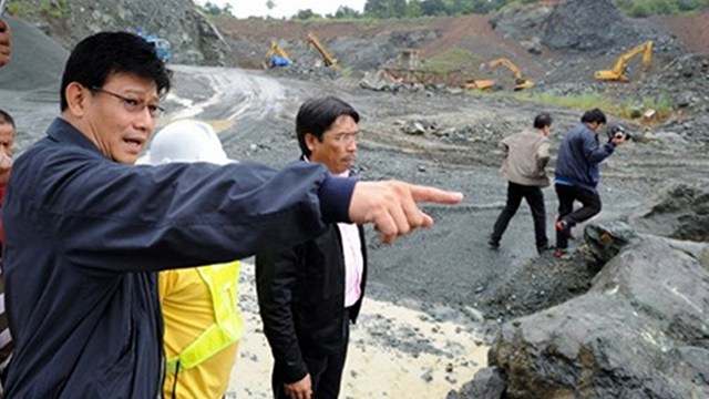 MINE. Environment Secretary Ramon Paje (left) says the mining council is finalizing how to collect the higher share of the government from mining activities. File photo from AFP