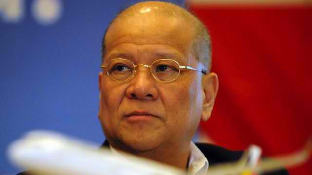 San Miguel president Ramon Ang listens during a press conference in Manila on August 28, 2012. AFP PHOTO/TED ALJIBE
