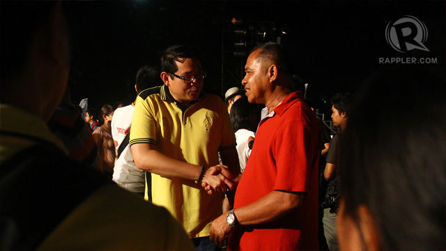 Benigno "Bam" Aquino speaks to a supporter. Photo by Raymund Amonoy