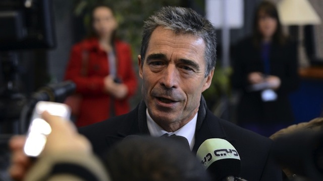 NATO chief Anders Fogh Rasmussen talks to the media upon arrival to the EU Council Building prior to the start of a meeting of European Union defense ministers, on November 19, 2012 in Brussels. AFP PHOTO/THIERRY CHARLIER