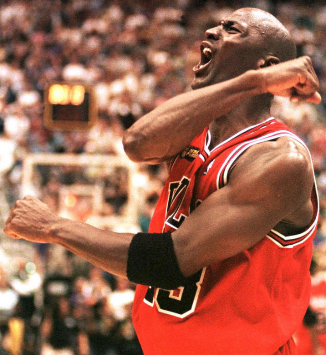 SIXTH RING. Michael Jordan of the Chicago Bulls celebrates 14 June after winning game six of the NBA Finals against the Utah Jazz at the Delta Center in Salt Lake City, UT. The Bulls won the game 87-86 to win their sixth NBA Championship. AFP PHOTO/Robert SULLIVAN