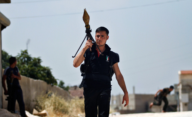 "Ridiculously Photogenic Syrian Rebel." Image from Reddit.com.