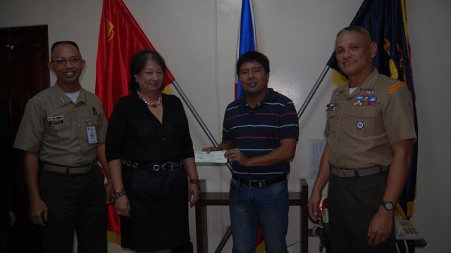 FOOTBALL FOR PEACE SCHOLAR. Asuncion Maria Faustmann, great granddaughter of Jose Rizal, donated P 50,000 for Sharifamae's education. In the presence of Philippine Marine Corps commandant Maj Gen Rustico Guerrero and Football for Peace proponent Lt Col Stephen Cabanlet, Zamboanga Football Association president Carlo Rodriguez received the amount on behalf of Sharifamae. Photo by PMC 