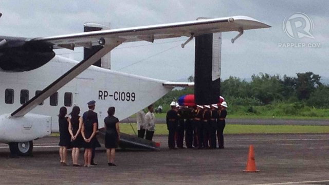 BACK HOME. Pallbearers carrying the casket with the remains of the late Interior and Local Government Secretary Jesse Robredo is being brought out of a chartered plane at the Pili Airport in Pili, Camarines Sur, August 26, 2012. Robredo's wife and daughters are looking on. Photo by Ruper Ambil.