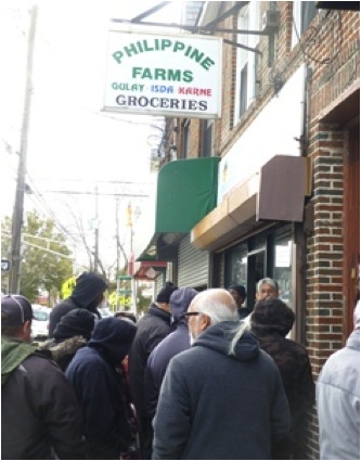 FILIPINO STORE. Filipinos line up for food supplies and other necessities at the Philippine Farm in Jersey City, one of a few establishments powered by a generator. Photo by PH consulate general in New York