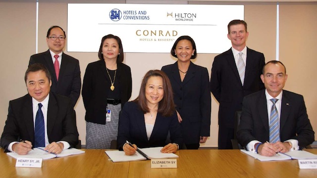 SMHCC TO MANAGE CONRAD MANILA. Henry Sy, Jr, Vice Chairman of SMIC; Elizabeth T. Sy, President of SMHCC and Martin Rick, President of Hilton Worldwide for Asia Pacific ink the deal. Photo courtesy of SMHCC