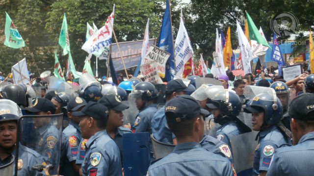 NO TOLERANCE. Protesters say they were pushed back by the police while negotiations were ongoing during the anti-SONA protest