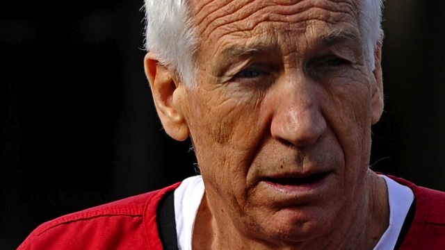 SENTENCED. Former Penn State assistant football coach Jerry Sandusky leaves the Centre County Courthouse after being sentenced in his child sex abuse case on October 9, 2012 in Bellefonte, Pennsylvania. The 68-year-old Sandusky was sentenced to at least 30 years and not more that 60 years in prison for his conviction in June on 45 counts of child sexual abuse, including while he was the defensive coordinator for the Penn State college football team. Patrick Smith/Getty Images/AFP