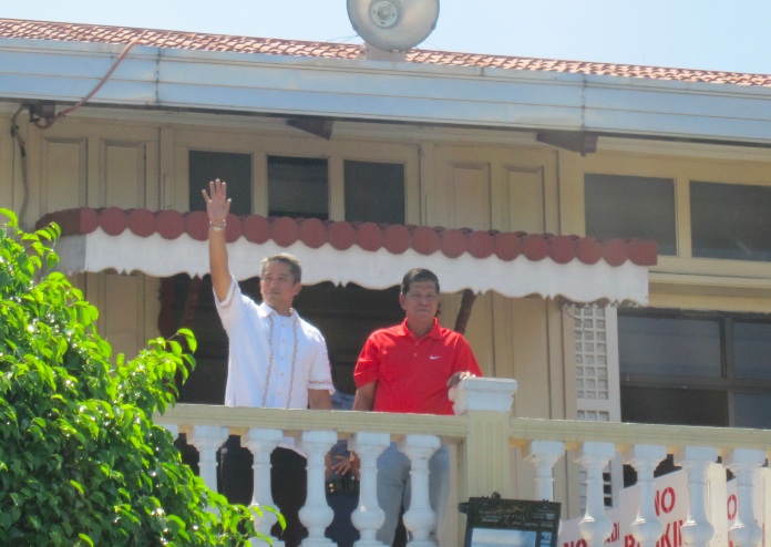 BACK IN CITY HALL. Mayor Homer Saquilayan, with Gov. Jonvic Remulla, at the balcony of Imus city hall. Photo by Mark Libanan