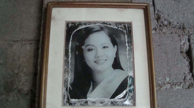 PLACE OF HONOR. A water-stained photo of the author hangs on an unfinished wall in Barrio Tumbar. All photos by Shakira Sison