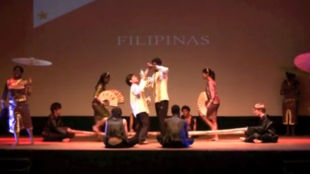LIGHTS. Students shine as the perform an intricate Filipino dance